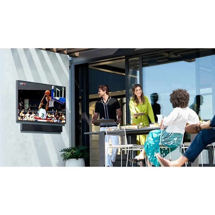 Samsung 65-inch Terrace QLED outdoor TV mounted on a patio wall