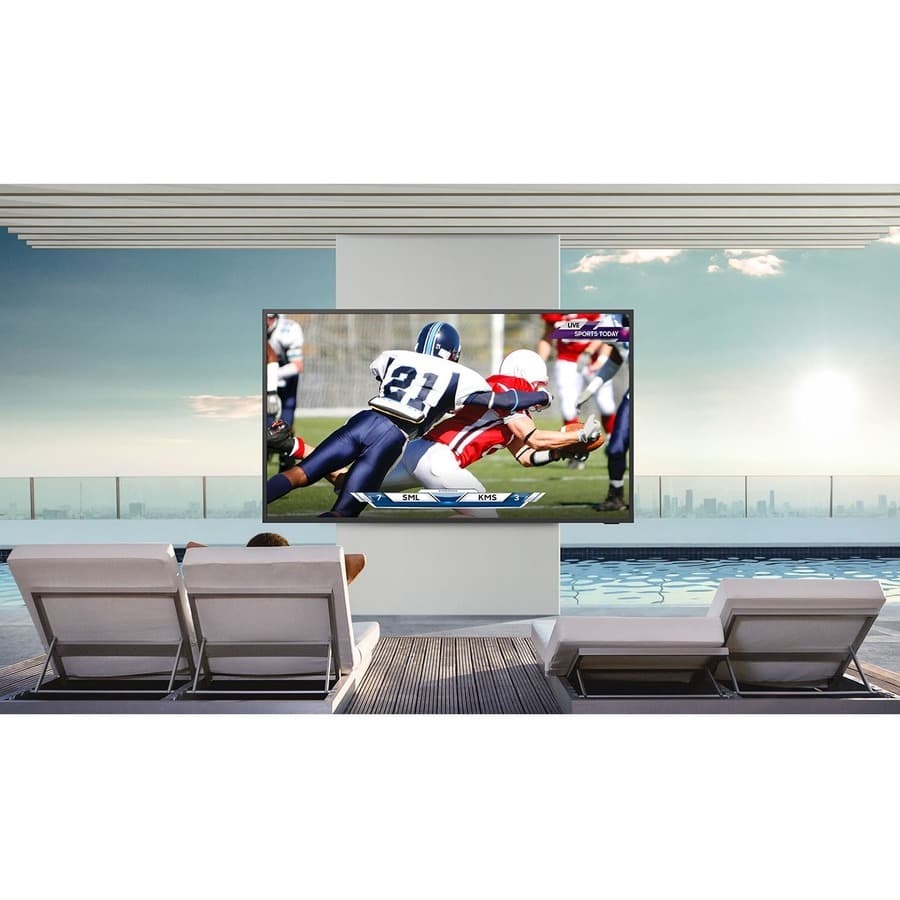 Samsung 65-inch Terrace QLED outdoor TV mounted on a patio wall